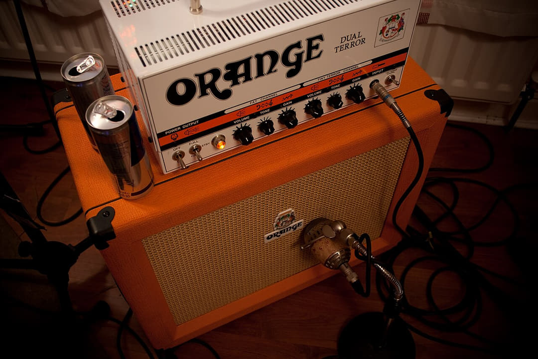 An Orange Dual Terror amplifier head with speaker cabinets, set up for re-amping.